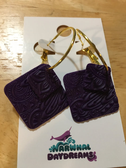 Textured dark purple squares on gold hoop earrings