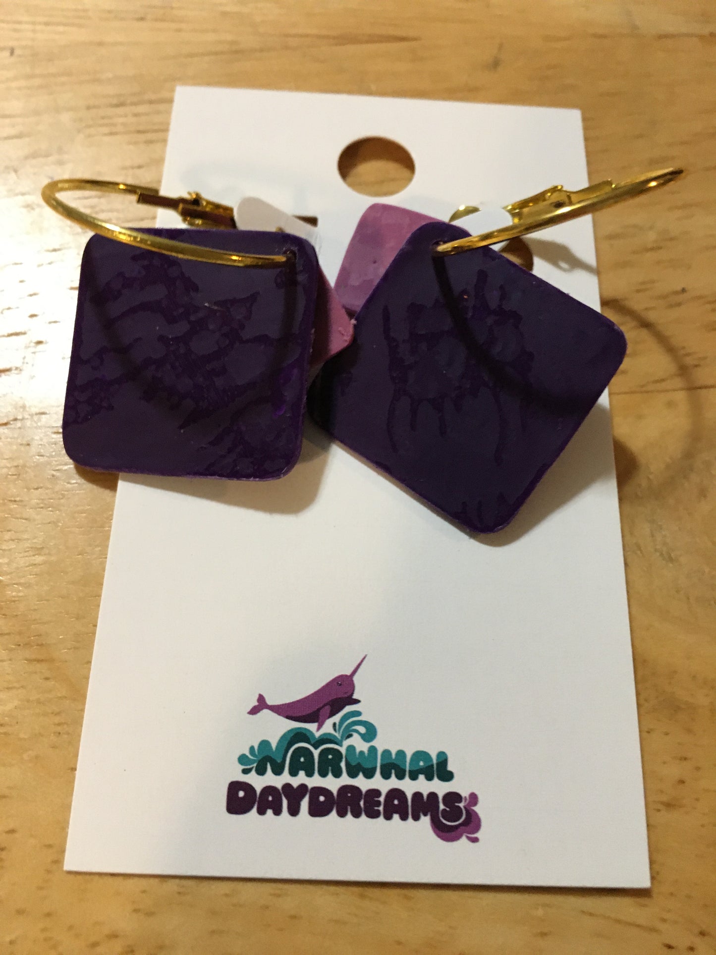Textured dark purple and mauvey-purple squares on gold hoop earrings