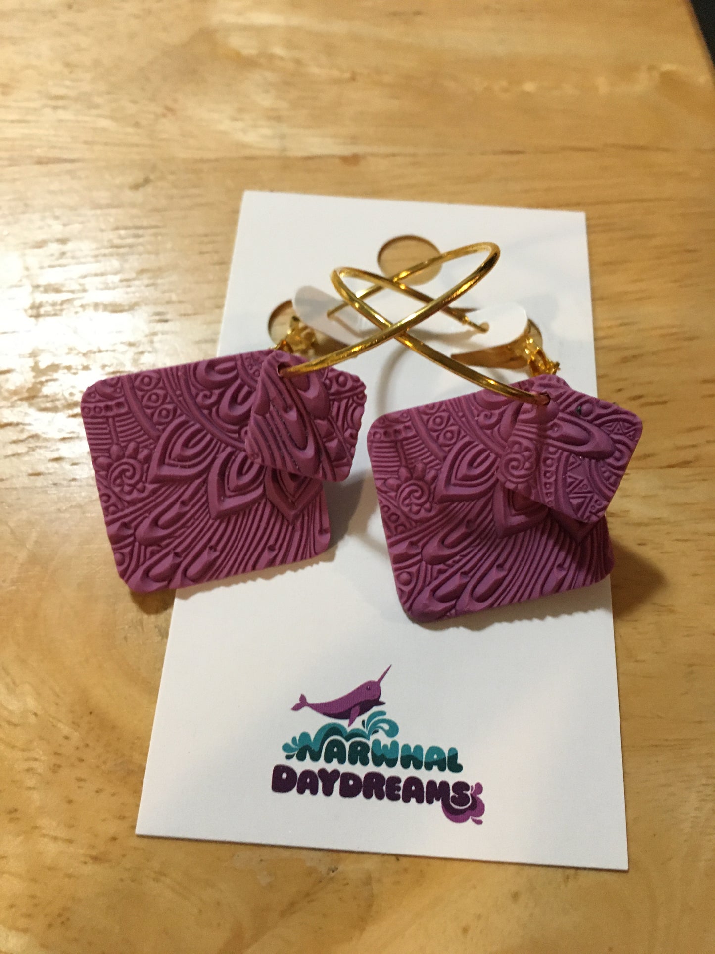 Textured mauvey-purple squares on gold hoop earrings