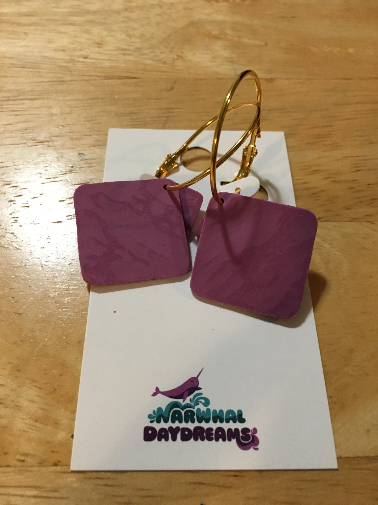 Textured mauvey-purple squares on gold hoop earrings