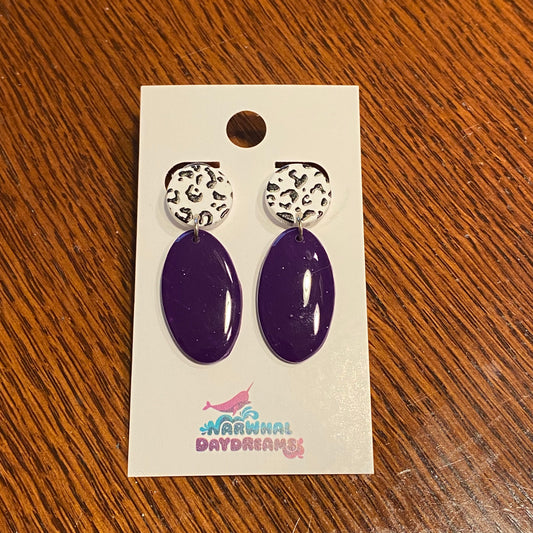 Deep purple earrings with black and white cheetah print posts